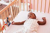 Baby sleeping in a crib