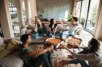 Young friends hanging out together at home