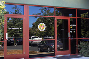 image of the glass doors to a county building.