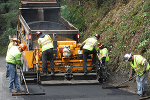 image of construction workings paving a road