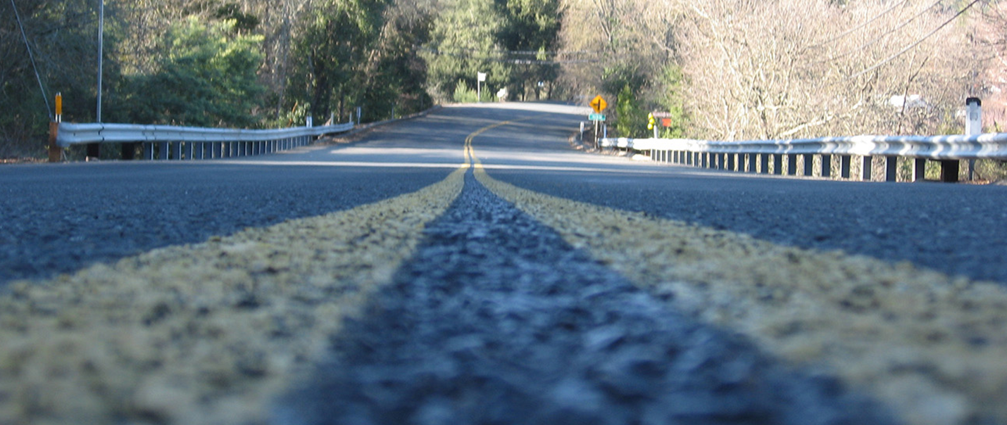 close-up image of double yellow lines on a road