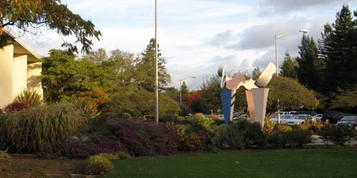 image of the exterior of an office building and an art sculpture 