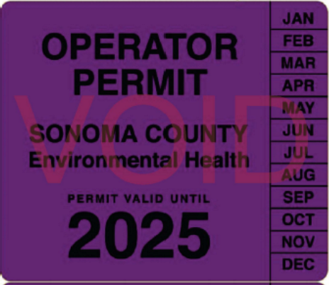 Example of food vendor permit. Purple square sticker with text reading "Operator Permit. Sonoma County Environmental Health" Permit also displays year and month it is valid through 