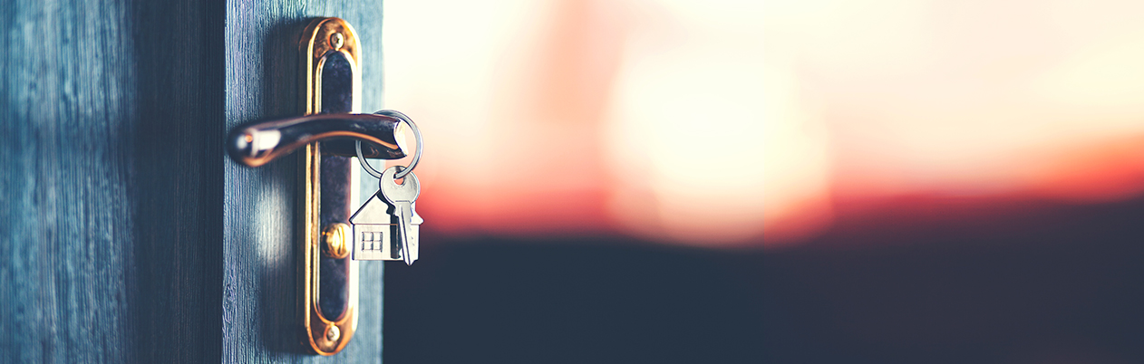 keys in a front door to a house